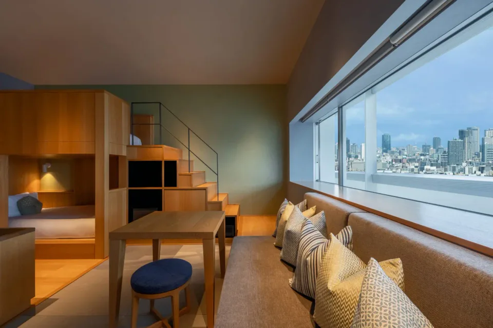 OMO7 Osaka DANDAN Room with tiered beds and lounge seating