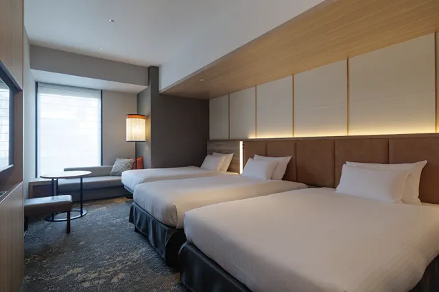 THE BLOSSOM HAKATA Premier Deluxe Twin room interior and window-side living space