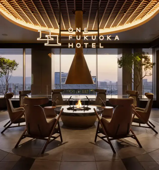 ONE FUKUOKA HOTEL high-floor common area and fireplace
