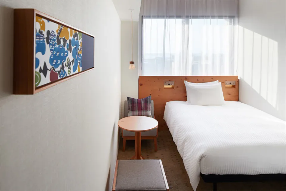 HOTEL STRATA NAHA double room with warm timber finishes