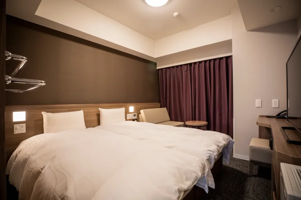 La Vista Furano Hills guest room with twin beds and Furano view