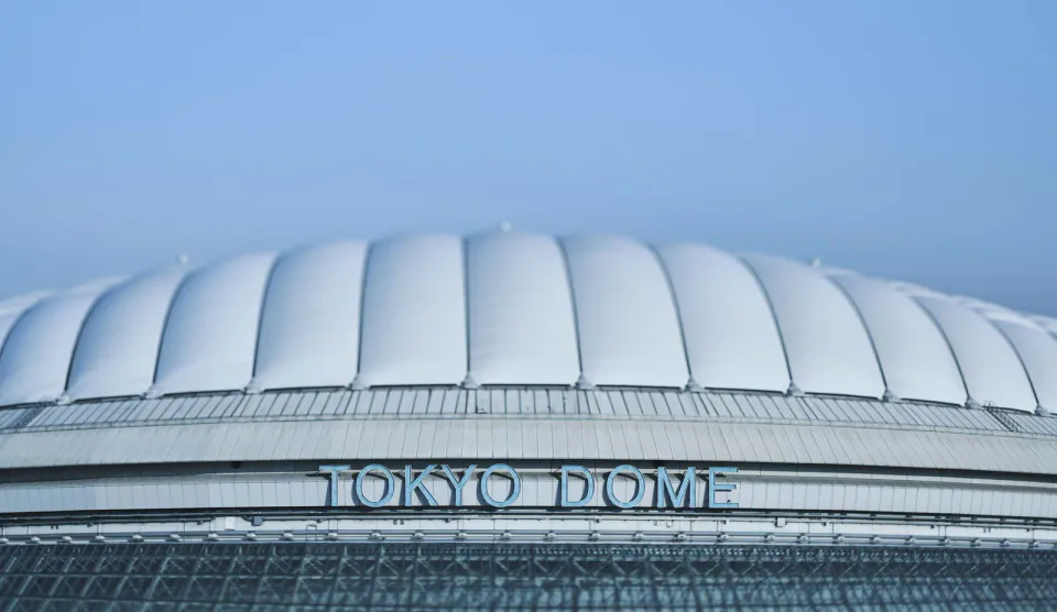 Tokyo Dome exterior beneath a clear blue sky