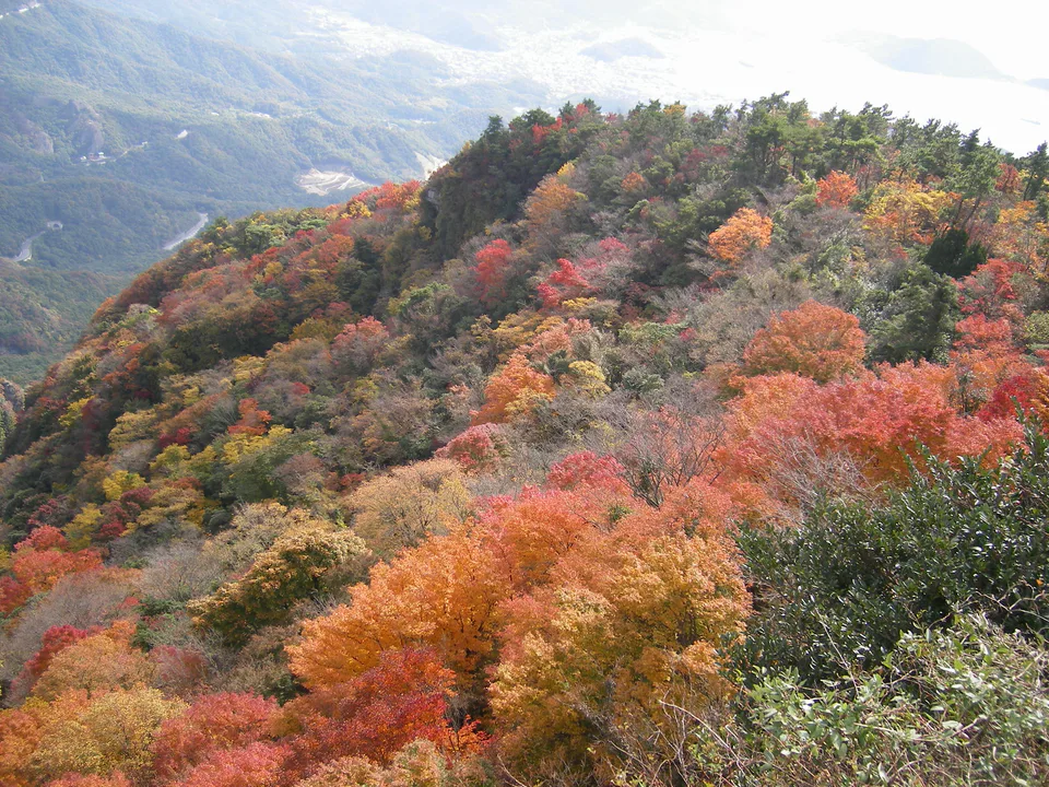 Kankakei Ropeway corridor through autumn forest and volcanic rock