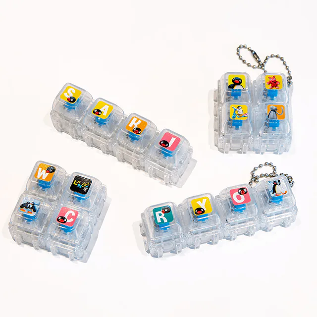 Custom Pingu keyboard keychain parts sold at the exhibition