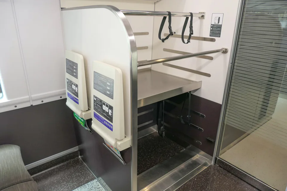 Large luggage rack inside a JR East E353 series train used for Fuji Excursion services