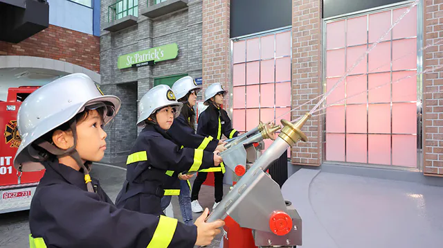 Children taking part in the firefighter activity at KidZania Fukuoka