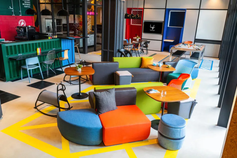 Colourful shared lounge and coworking area at lyf Tenjin Fukuoka