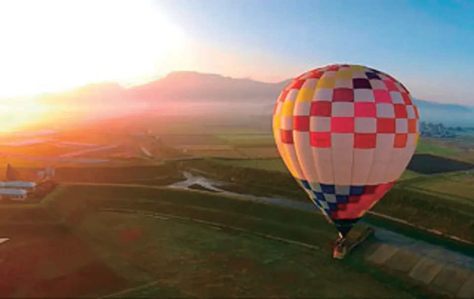 Hot-air balloon over the Aso landscape