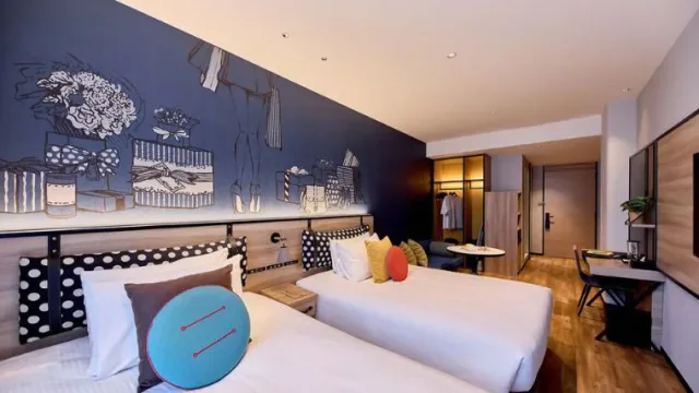 Citadines Namba Osaka family apartment with twin beds, dining table and sofa