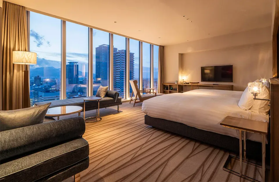 SAPPORO HOTEL by GRANBELL suite interior with lounge seating