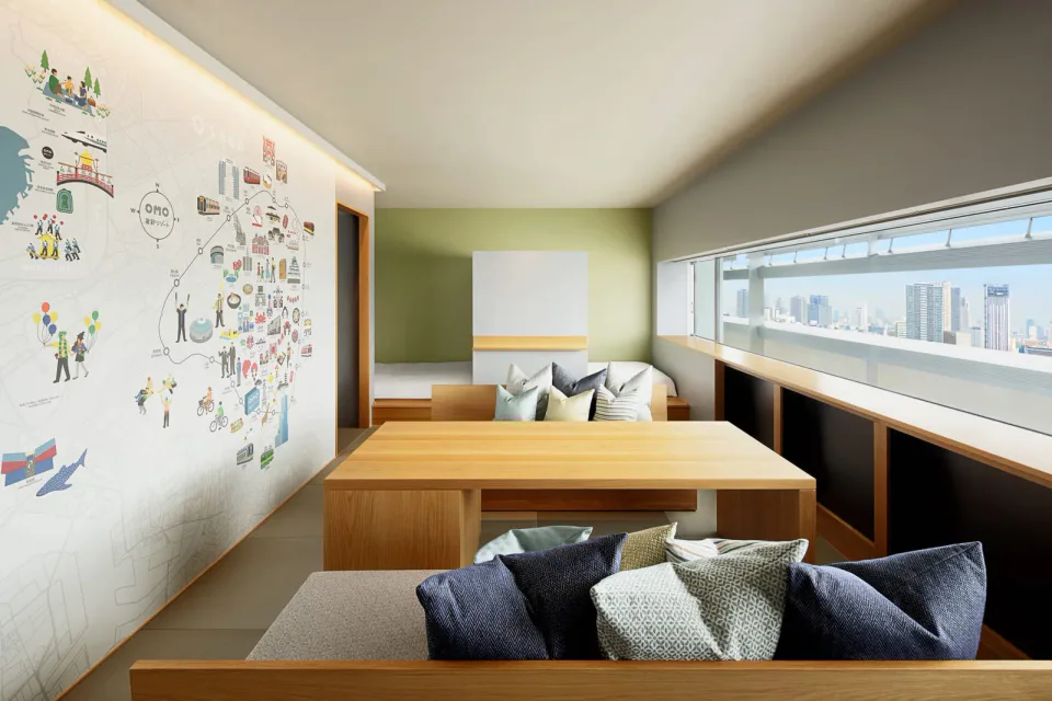 OMO7 Osaka IDOBATA Suite with lounge seating and Osaka mural