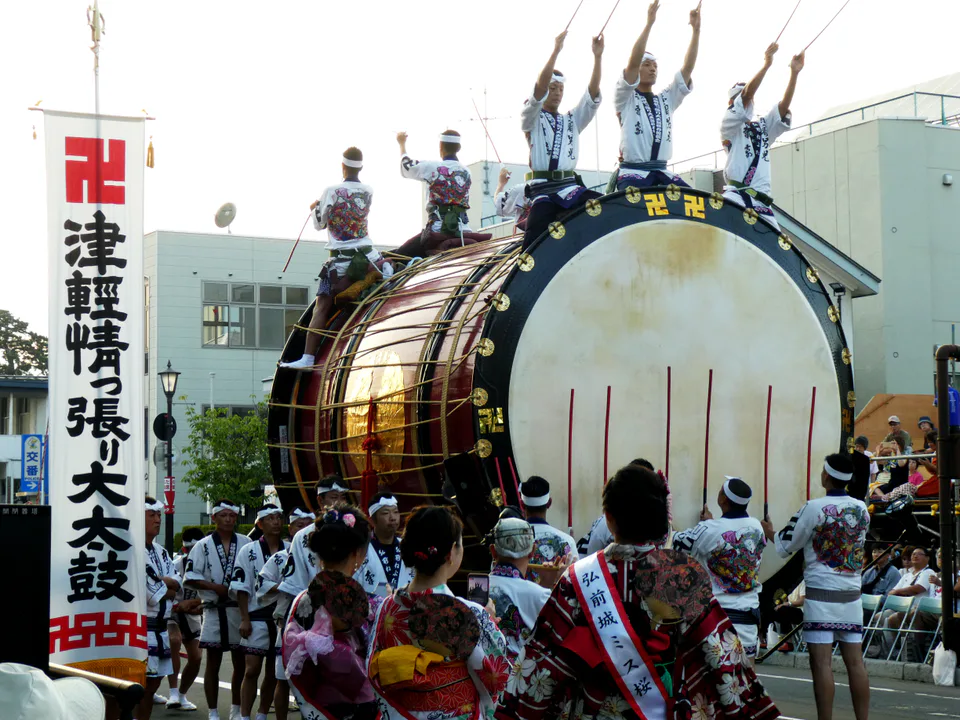 Hirosaki Neputa participants and illuminated float moving through the street