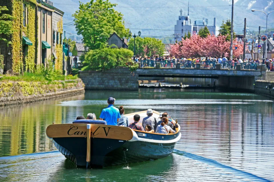Otaru Canal Cruise passing the port town's preserved waterfront warehouses