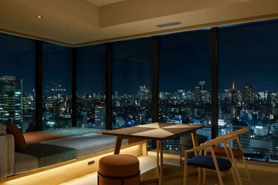 OMO5 Tokyo Gotanda OMO House Suite with corner windows and dining table