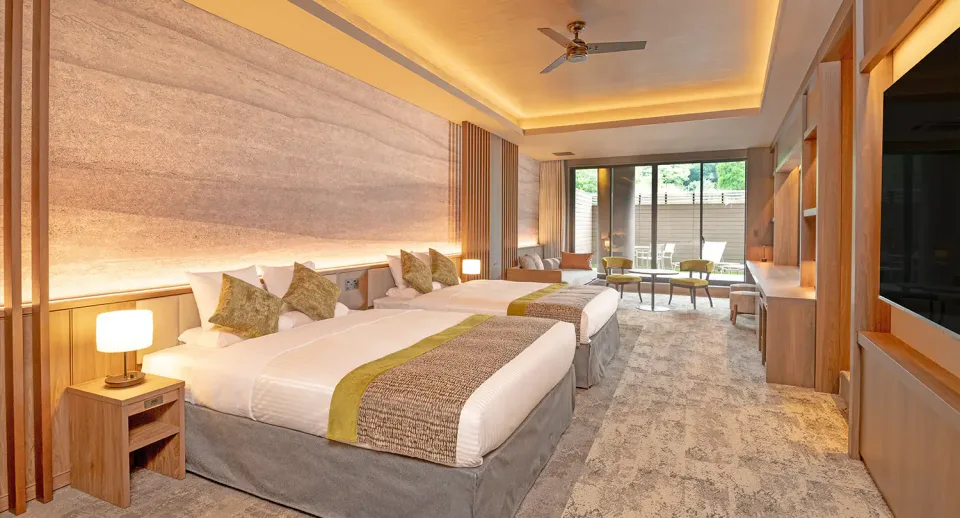 Premium guest room with a private open-air bath at KAMENOI HOTEL ASO for an overnight Aso itinerary