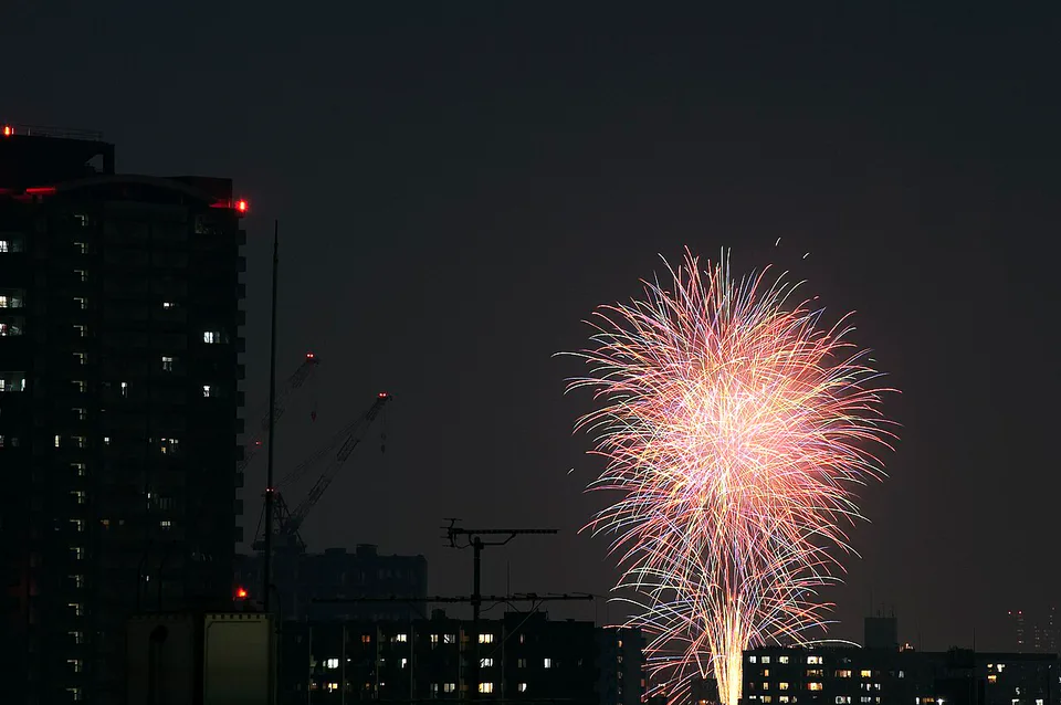 Sumida River fireworks over the Tokyo cityscape