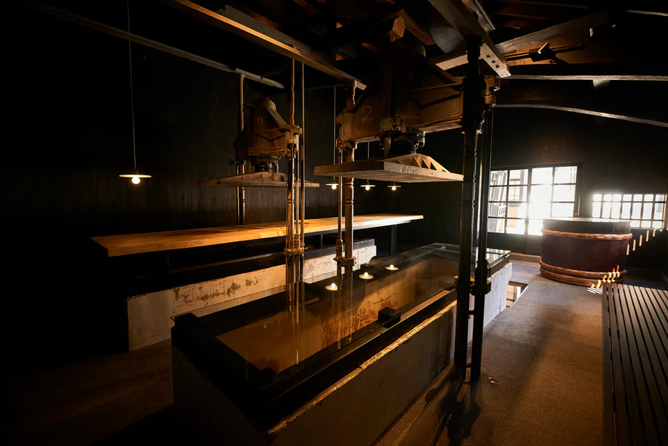 Inside Fukuoka Munakata Sake Brewery Izuhonten, where the 2026 visitor experience combines visible brewing, a sake bar, direct shop and historic displays