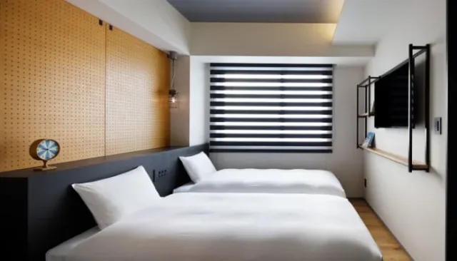 LAMP LIGHT BOOKS HOTEL Fukuoka Moderate Double room with reading sofa and bedside lamps