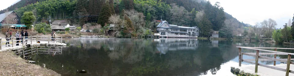 Panoramic autumn view across Lake Kinrin and the surrounding Yufuin hills