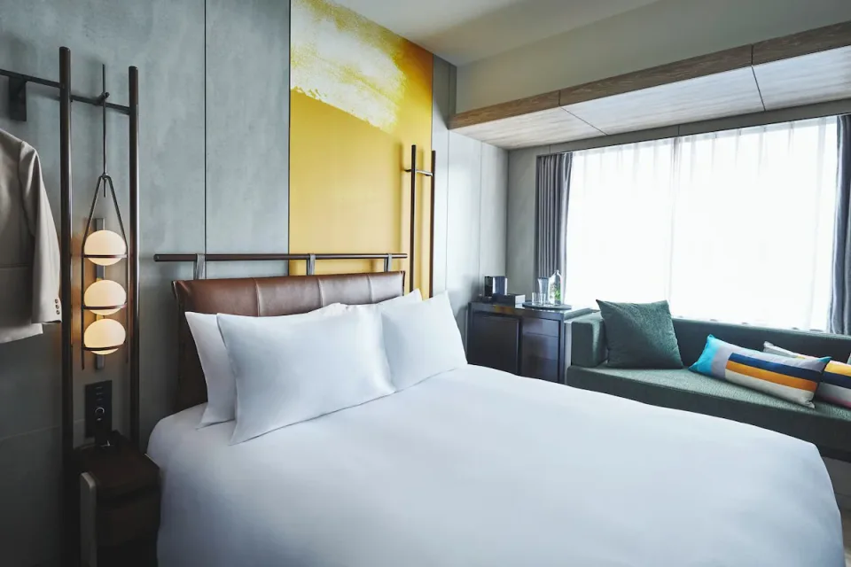 voco Osaka Central premium room with king bed and window sofa