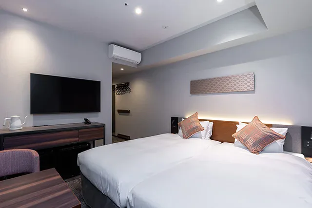 TOKYU STAY Osaka Hommachi guest room with sofa and kitchenette
