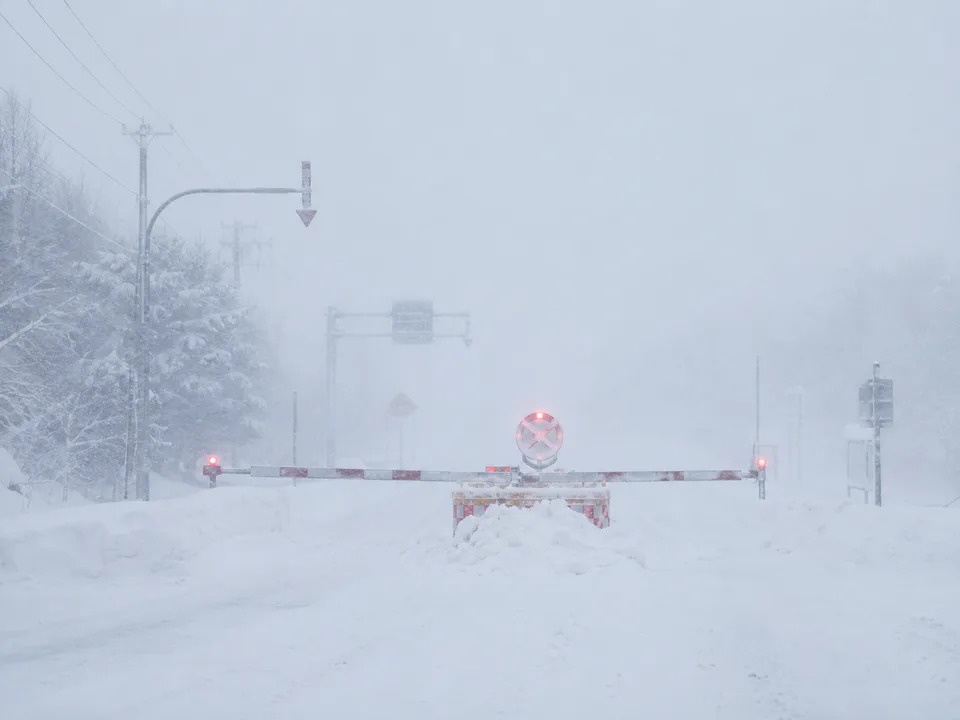 Hokkaido blizzard whiteout and road closure barrier