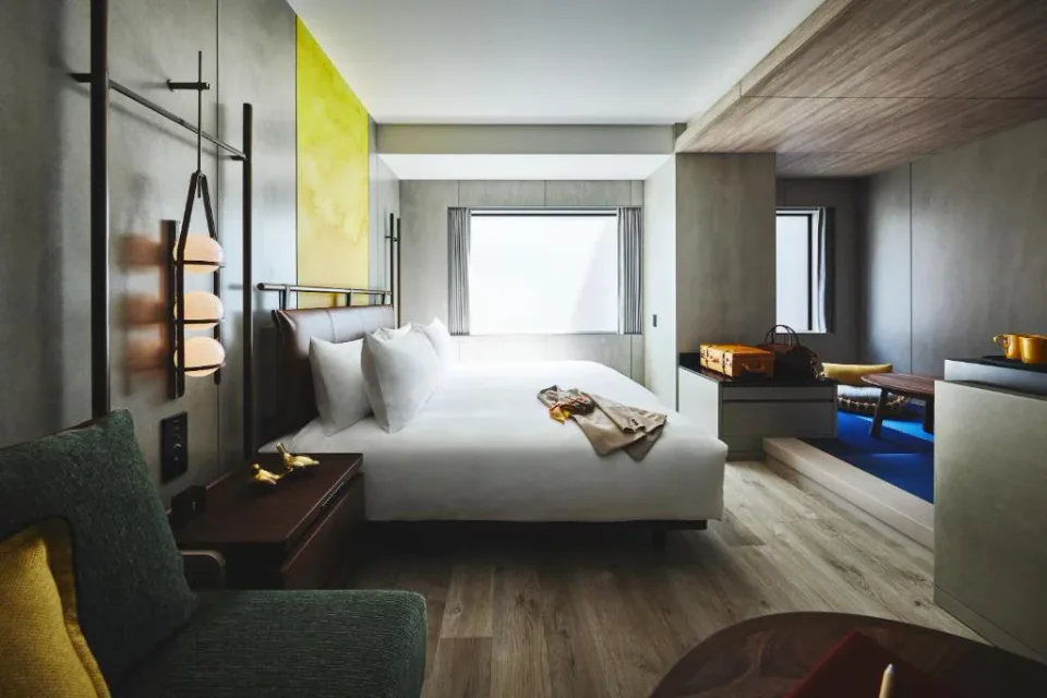 voco Osaka Central guest room with king bed and seating area