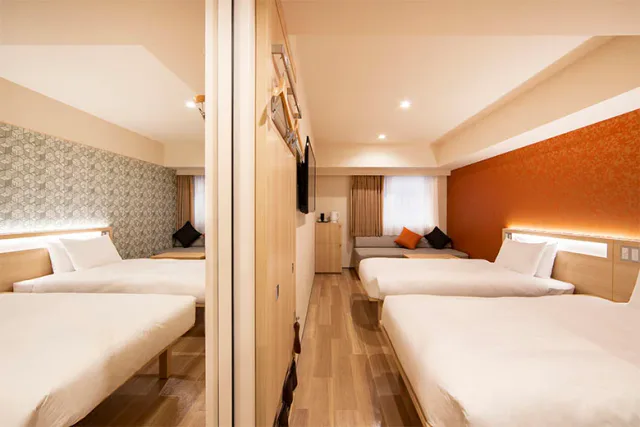 karaksa hotel TOKYO STATION guest room with beds and seating