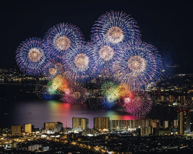Lake Biwa Fireworks 2026 spreading across the water beside Otsu