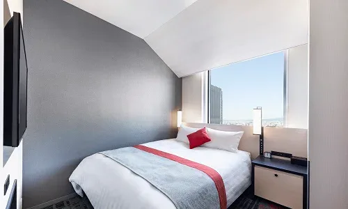 Hotel Hankyu RESPIRE OSAKA double guest room with queen bed