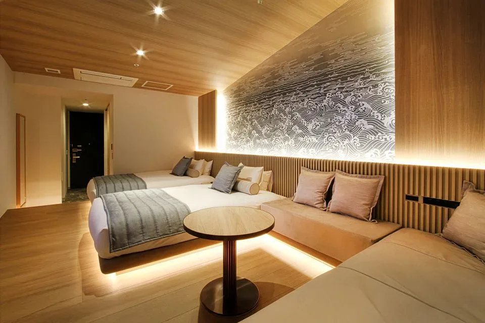 La'gent Stay Hakodate Ekimae train and ocean view room with twin beds and lounge seating
