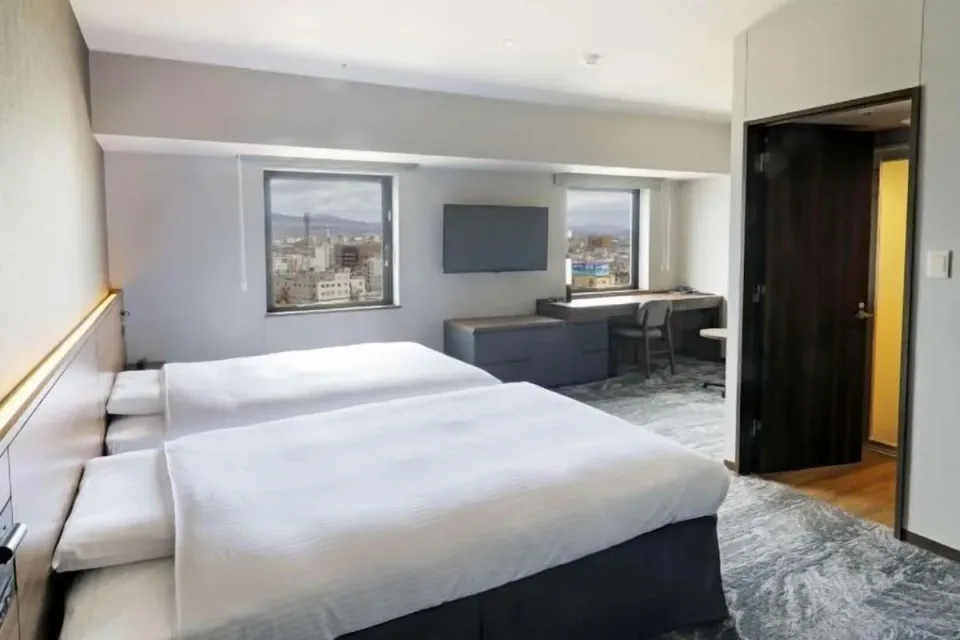 JR Inn Hakodate guest room with twin beds and desk