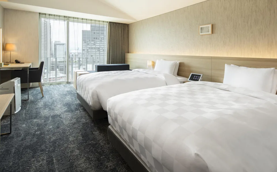 Hotel Royal Classic Osaka standard guest room with bed and open floor area