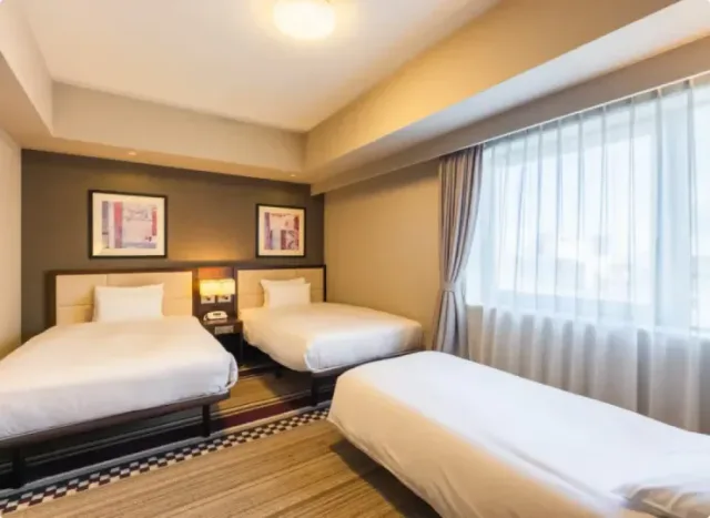 Hotel Sunroute Plaza Shinjuku triple guest room with large window