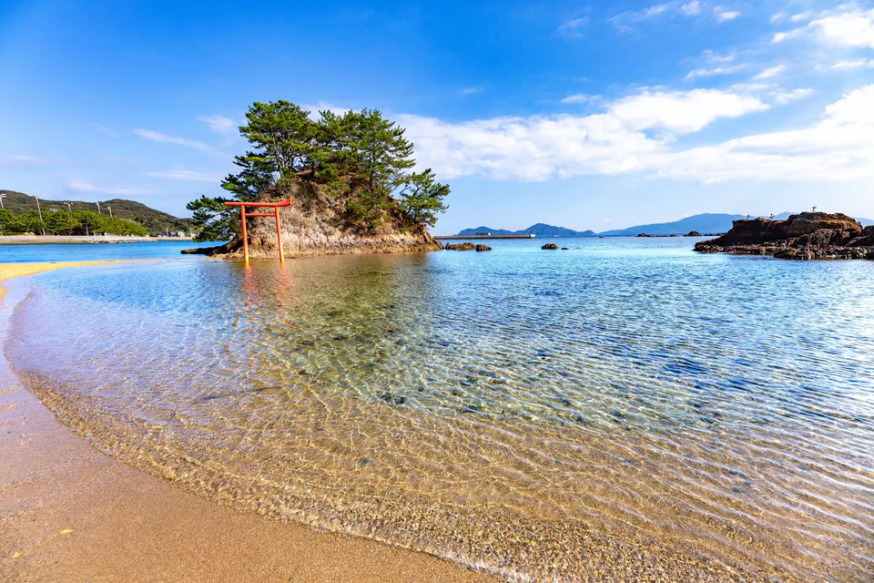 A coastal landscape on the Munakata-Oshima route, illustrating why weather and visibility strongly affect this island day trip.