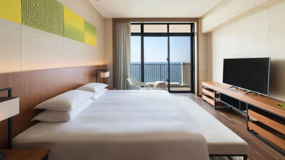 Hyatt Regency Seragaki Island Okinawa sunset suite bedroom with ocean balcony