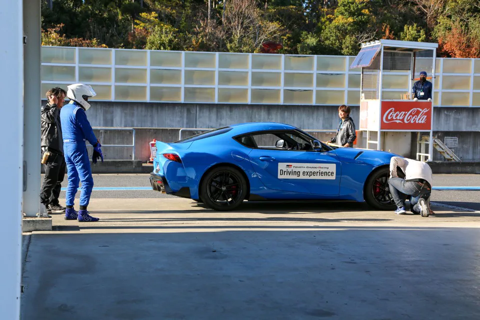 GR Supra in the pit area. A Fuji Speedway GR rental suits travelers without their own car who specifically want to drive the main circuit themselves.