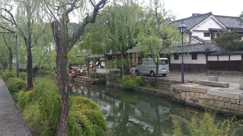 Kurashiki canal and white-walled storehouses during an autumn afternoon walk