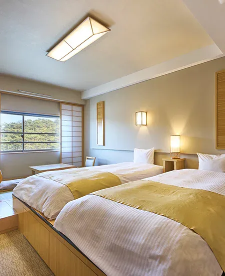 Stylish twin guest room at Oarai Hotel for a coastal sunrise stay without a car
