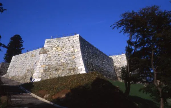Restored stone walls at Nihonmatsu Castle honmaru showing multiple phases of castle construction