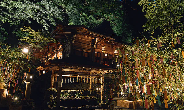 Red lantern approach at Kifune Shrine in summer greenery
