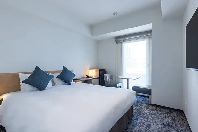 TOKYU STAY Osaka Hommachi guest room with bed and work desk
