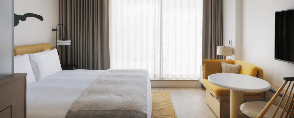 Zentis Osaka Studio room with king bed and large windows