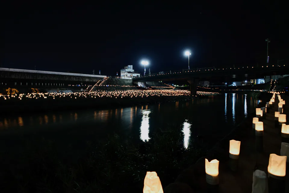 Bamboo lantern reflections along the Kagetsu River during Sennen Akari