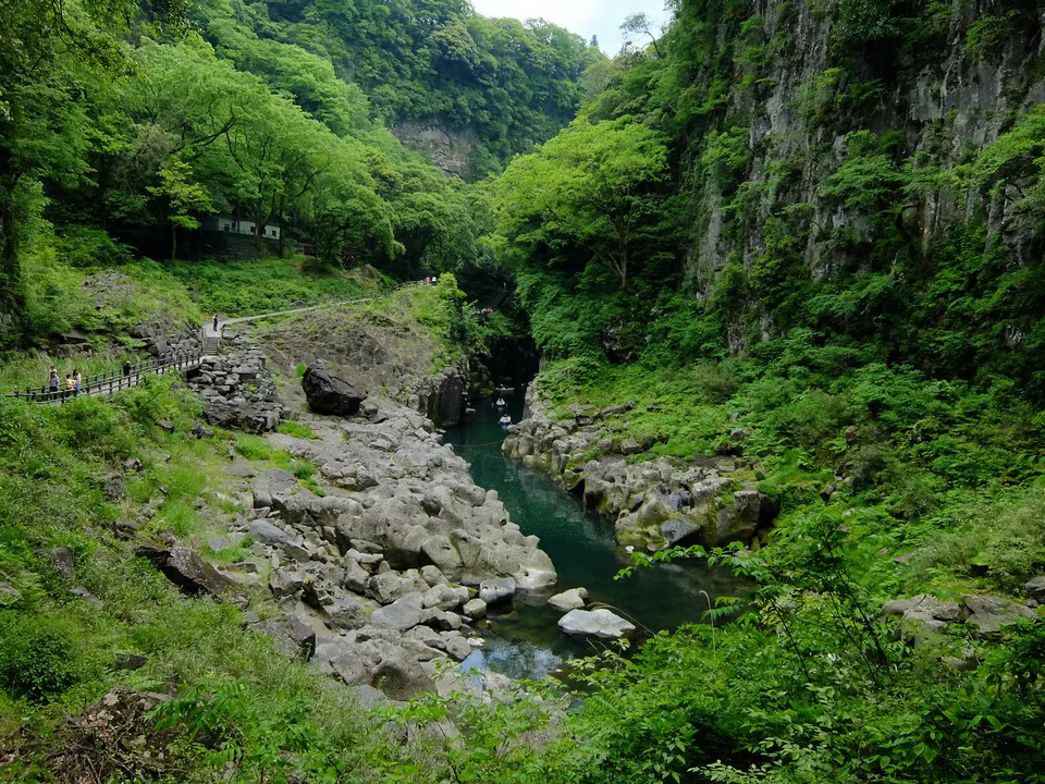 Takachiho Gorge promenade beside basalt cliffs during an autumn visit