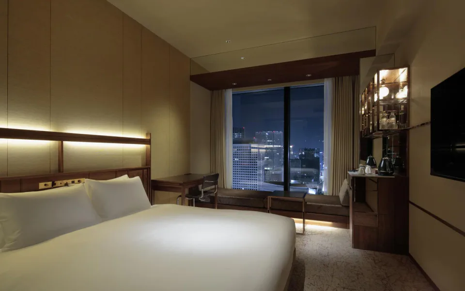 CANDEO HOTELS Osaka The Tower room with bed, work desk and Osaka skyline